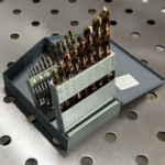 Cobalt jobber drill bit set in metal index case on welding table, precision ground twist drills for steel