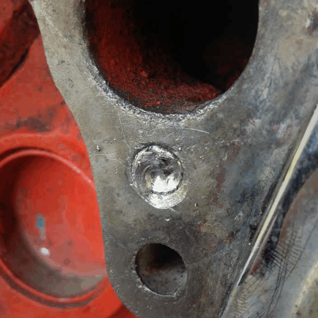 Broken bolt broken off flush in metal requiring drilling, removal, and extraction