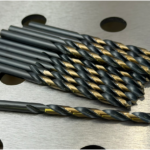 Black and gold HSS Jobber drill bits laying on table