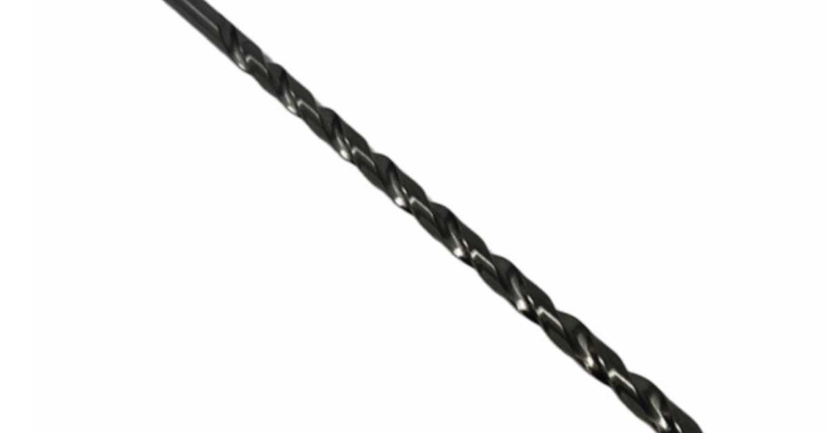 Single long black twist drill bit lies diagonally on a white background, showing spiral flutes and pointed tip.