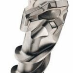Close-up of a silver masonry drill bit tip with sharp carbide edges and spiral grooves on a white background.