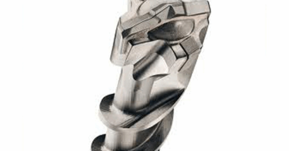 Close-up of a silver masonry drill bit tip with sharp carbide edges and spiral grooves on a white background.
