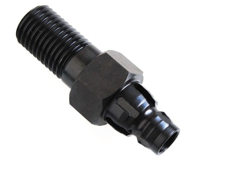 Close-up of a black drill adapter featuring threaded and quick-connect ends against a white background.