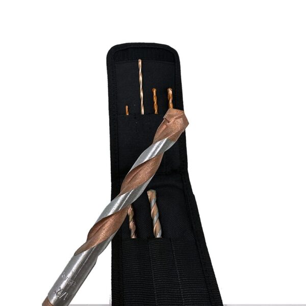 Assorted masonry drill bits sit in a black fabric storage case, with one large brown and silver bit displayed in front.